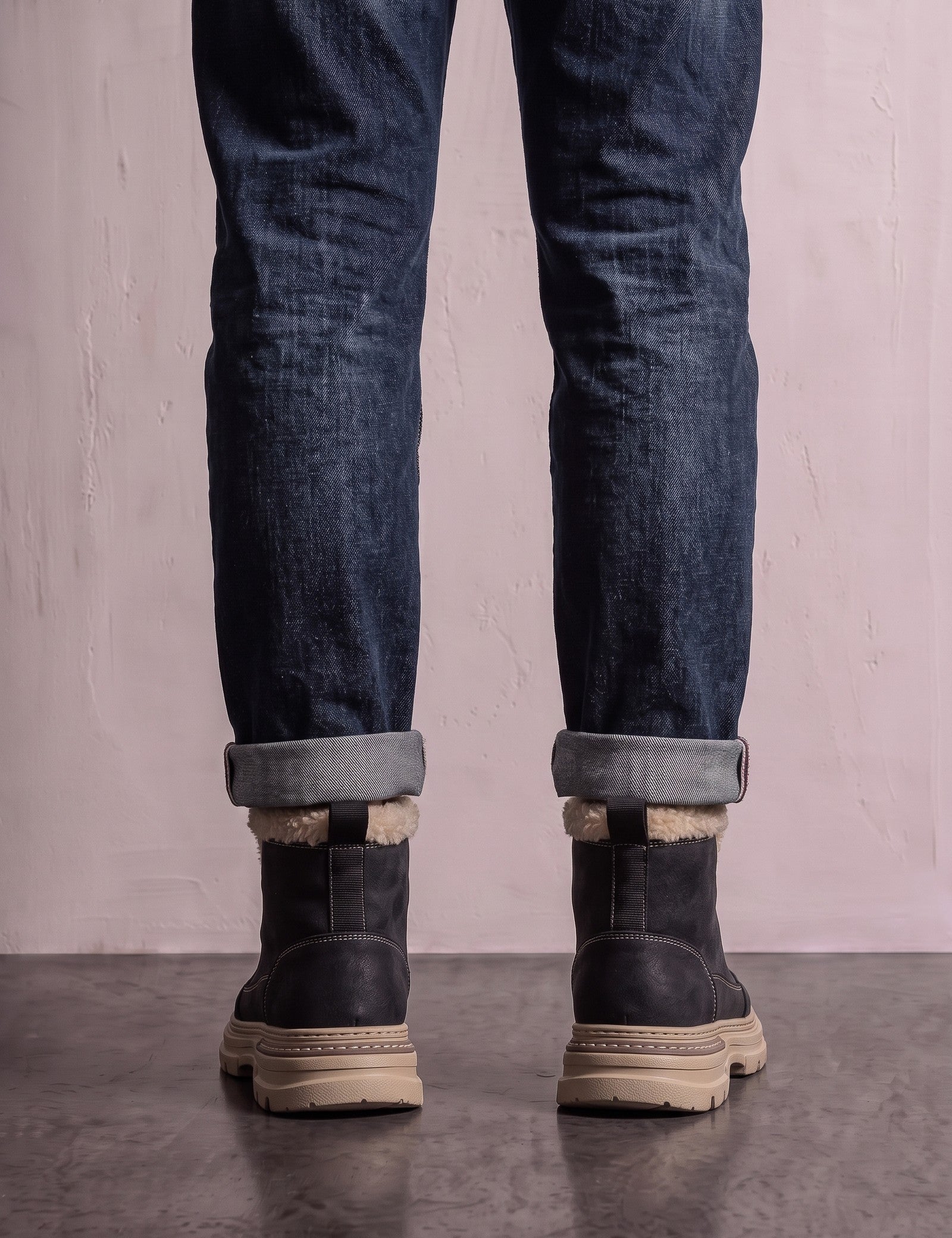 Men's Black Fleece-Lined Lace-Up Boots, back view of the heels, worn.