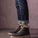 Men's Black Fleece-Lined Lace-Up Boots, side view of the shoe, worn.