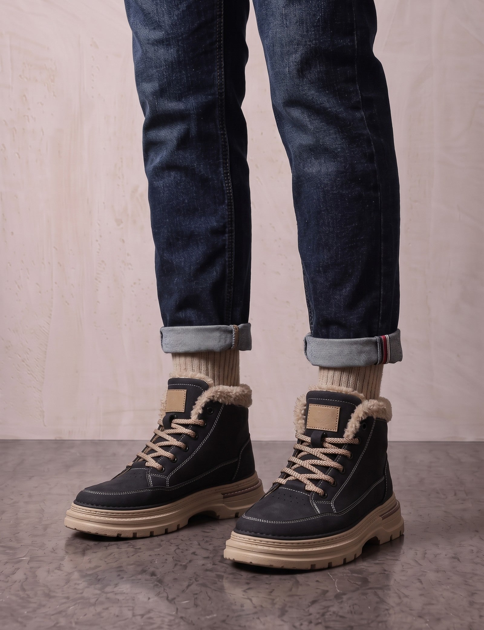 Men's Black Fleece-Lined Lace-Up Boots, three-quarter front view of the shoes, worn.