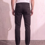 Men's Black Slim Fit Tapered Chino Trousers, back view from the waist down.