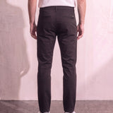 Men's Black Slim Fit Tapered Chino Trousers, back view from the waist down.