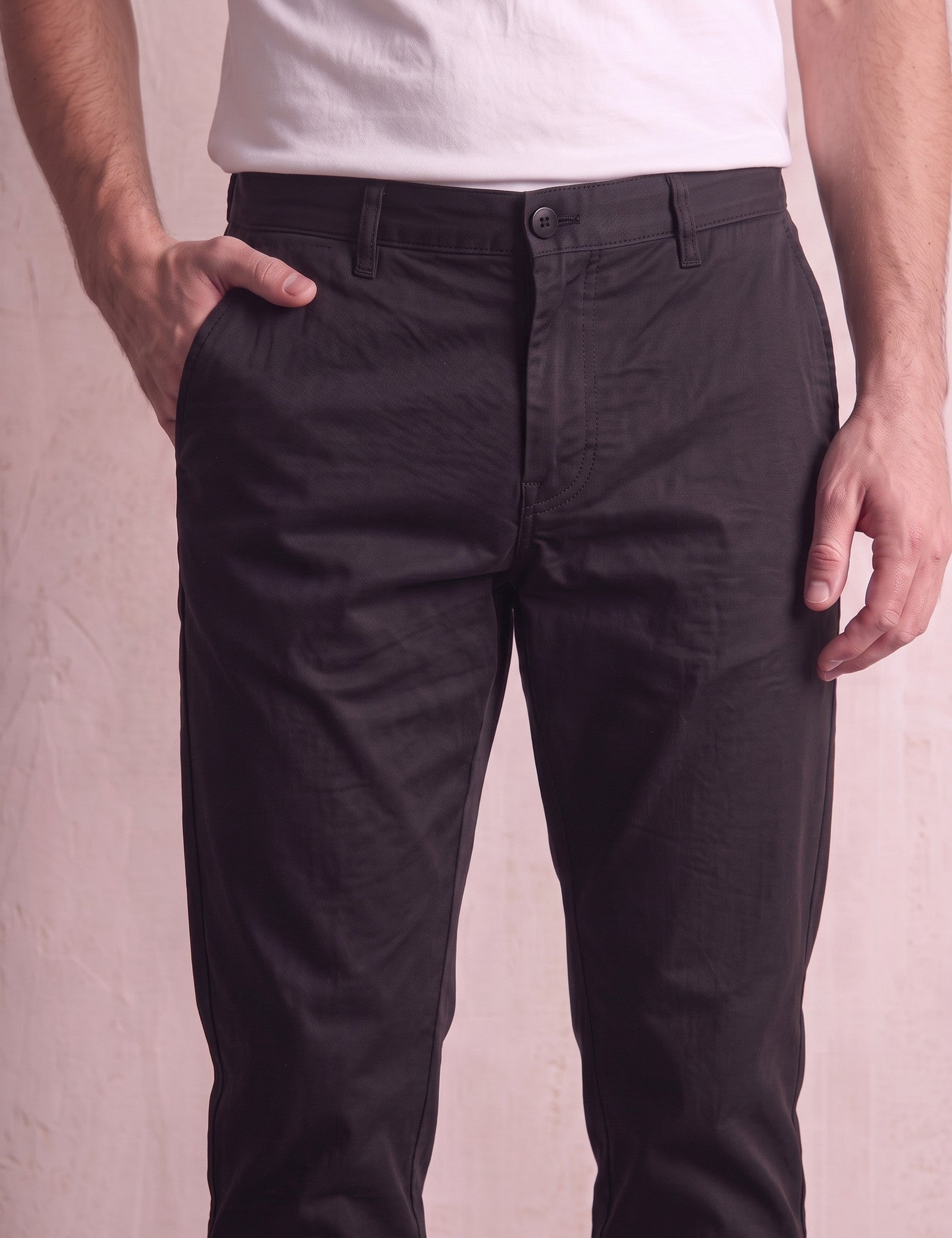 Men's Black Slim Fit Tapered Chino Trousers, close-up of the waistband and front pocket.