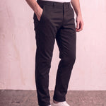 Men's Black Slim Fit Tapered Chino Trousers, three-quarter view from the waist down.