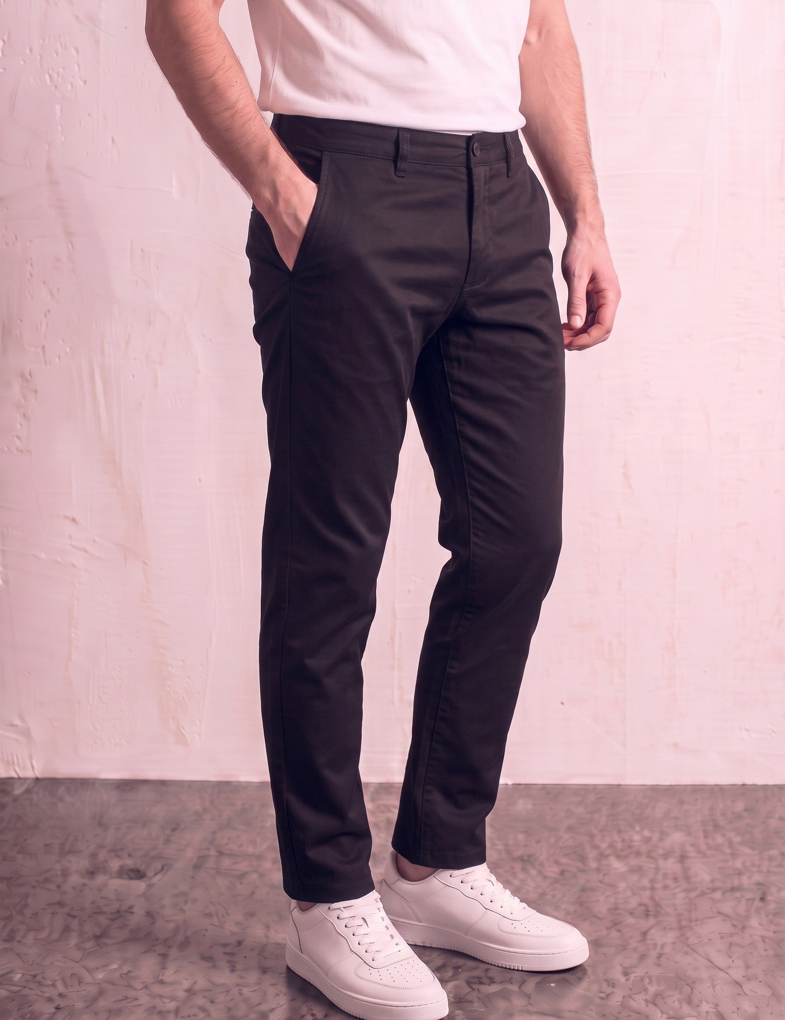 Men's Black Slim Fit Tapered Chino Trousers, three-quarter view from the waist down.