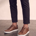 Men's Brown Low-Top Trainers, three-quarter front view of the shoes, worn.