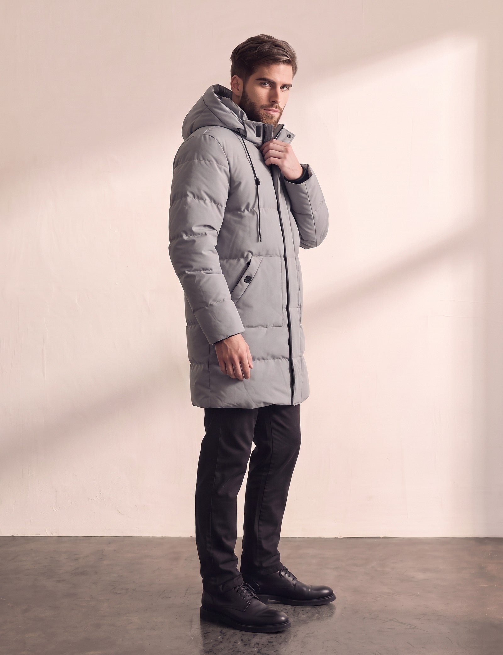 Men's Grey Long Quilted Parka with Drawstring Hood, side view, full length.