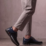 Men's Navy Smart Lace-Up Shoes with Checked Panel, the shoes in mid-step, showing the sole.