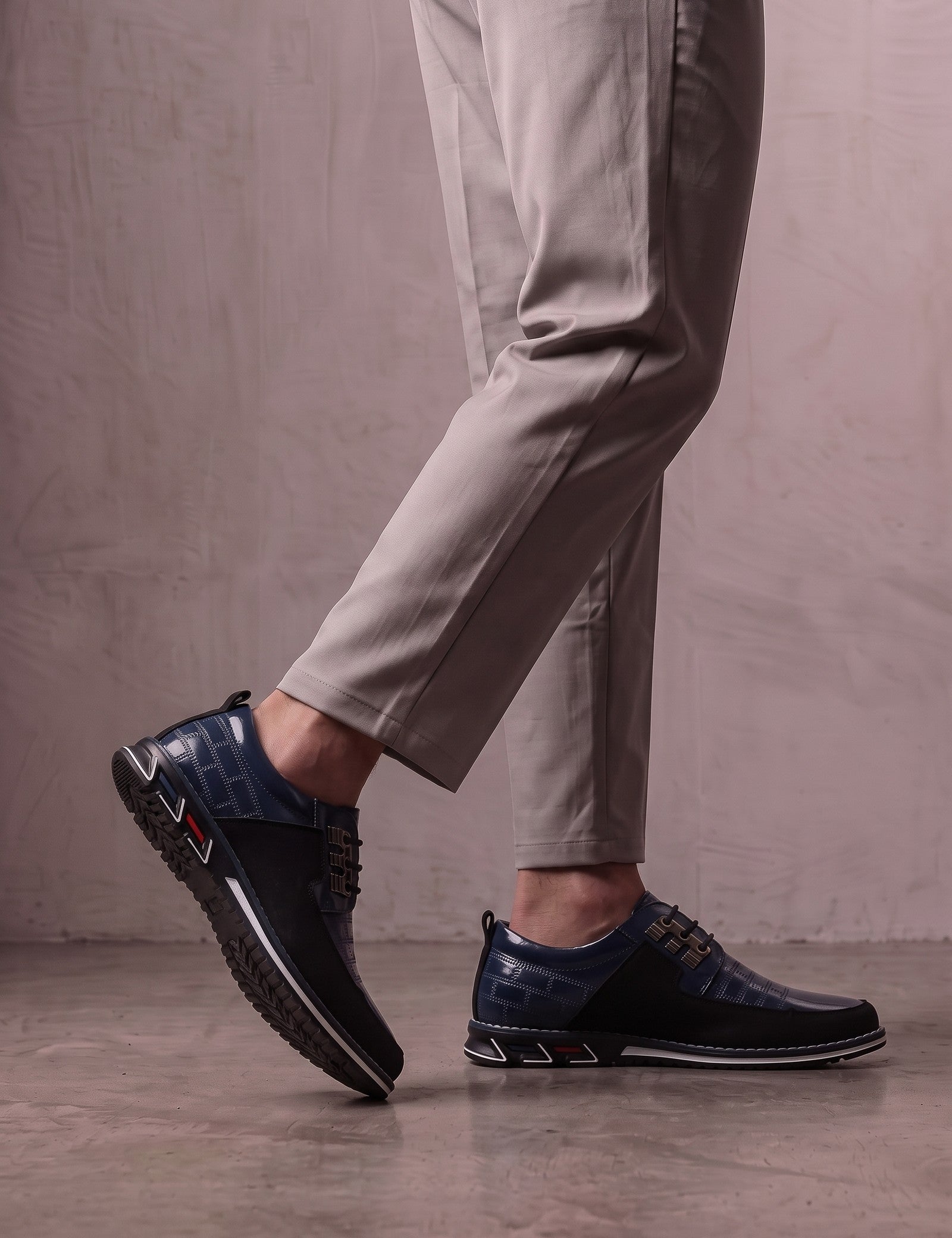 Men's Navy Smart Lace-Up Shoes with Checked Panel, the shoes in mid-step, showing the sole.
