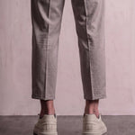 Men's Taupe Faux Leather Low-Top Trainers, back view of the heels, worn.