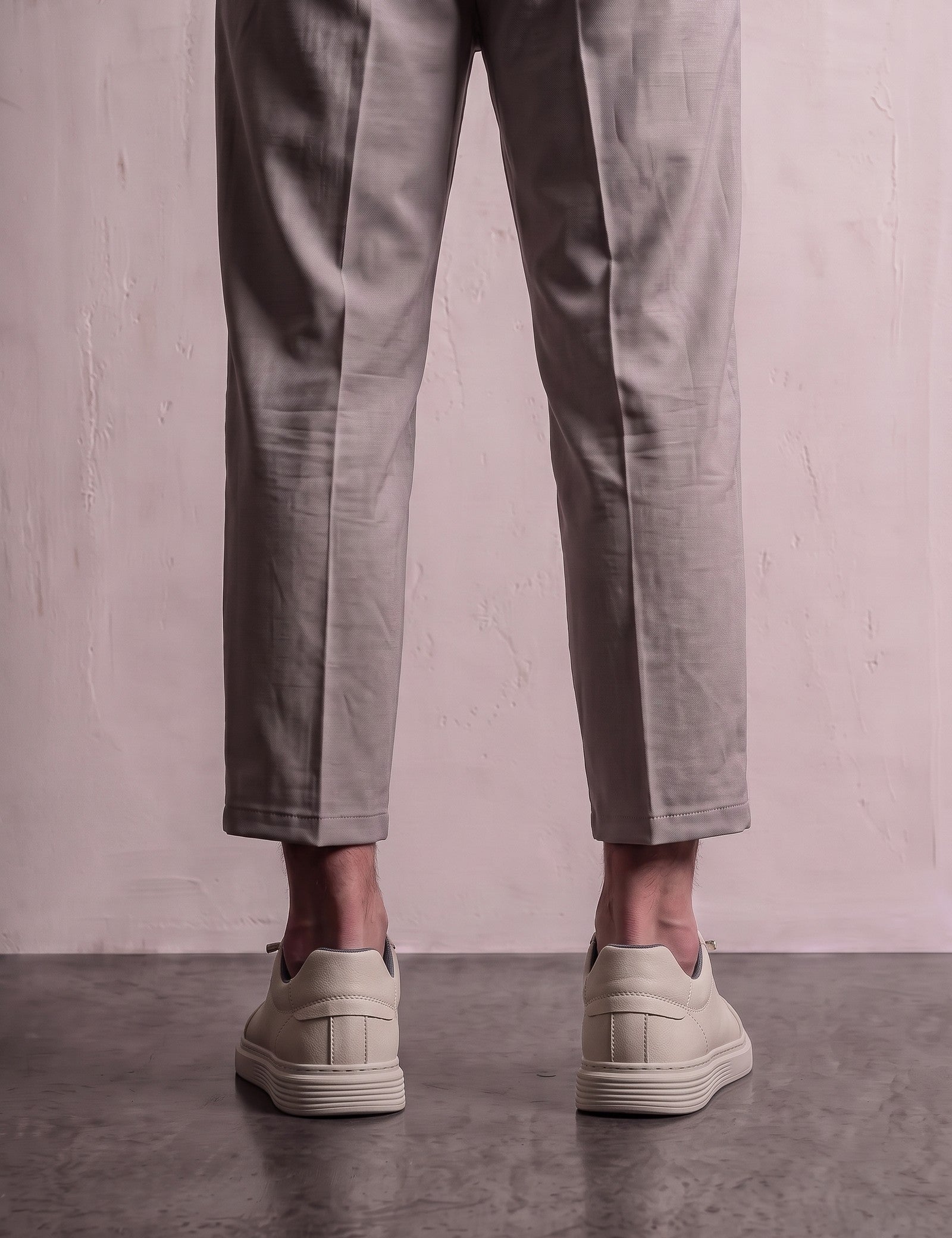 Men's Taupe Faux Leather Low-Top Trainers, back view of the heels, worn.