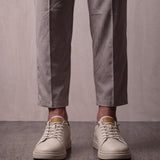 Men's Taupe Faux Leather Low-Top Trainers, front view of the shoes, worn.