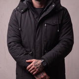 Men's Anthracite Hooded Padded Parka with Pockets, close-up of the upper body.
