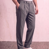 Men's Anthracite Pleated Straight-Leg Suit Trousers, three-quarter view from the waist down.