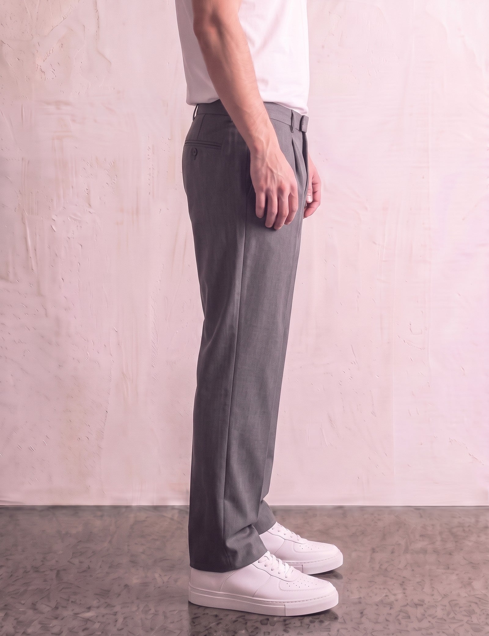 Men's Anthracite Pleated Straight-Leg Suit Trousers, side view from the waist down.