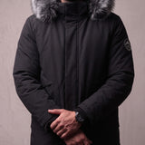 Men's Black Hooded Parka with Fur-Effect Trim, close-up of the upper body.