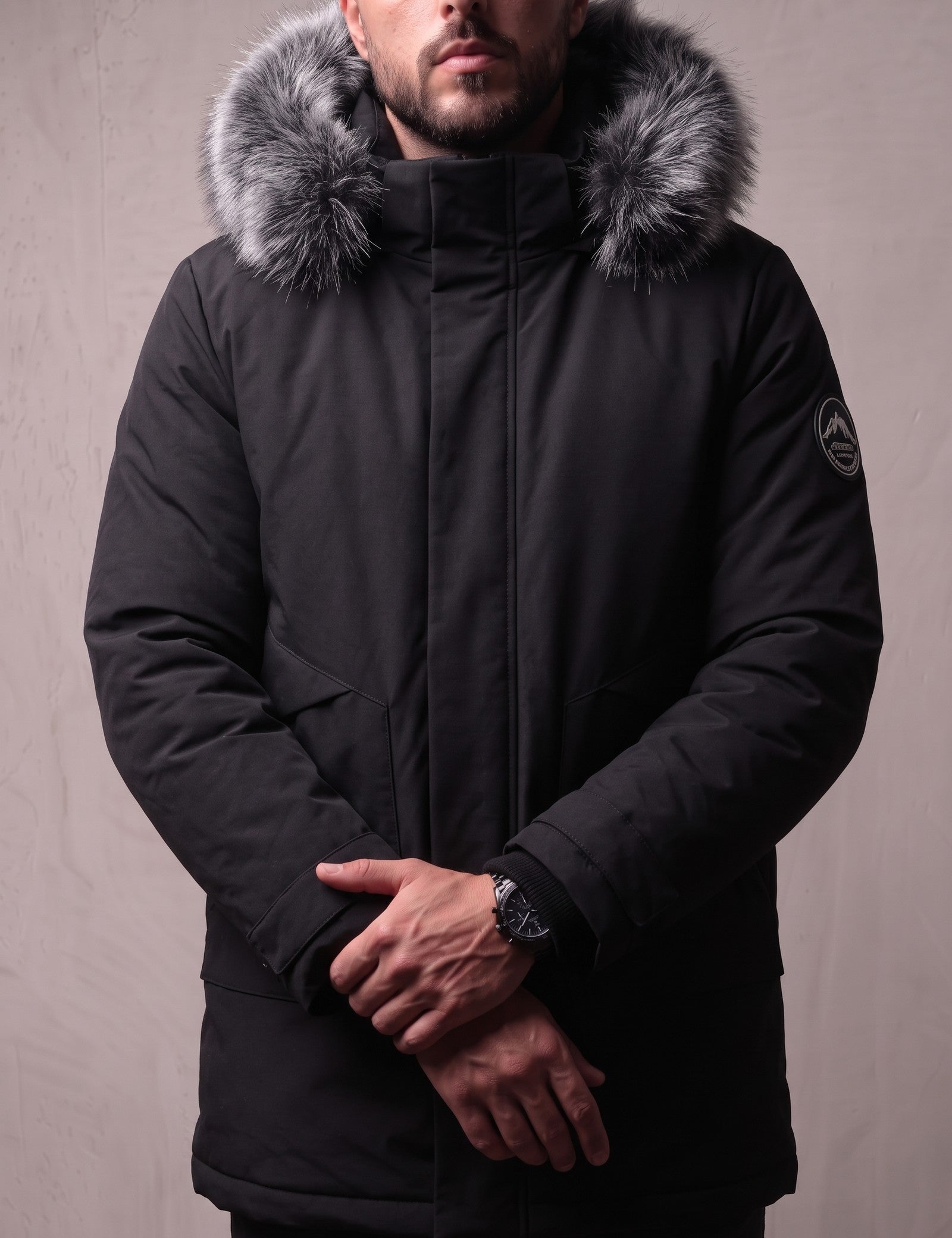 Men's Black Hooded Parka with Fur-Effect Trim, close-up of the upper body.