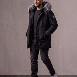 Men's Black Hooded Parka with Fur-Effect Trim, three-quarter view from the right, full length.