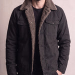 Men's Black Sherpa-Lined Jacket with Chest Pockets, close-up of the upper body.