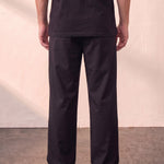 Men's Black Wide Leg Pleated Trousers, back view from the waist down.