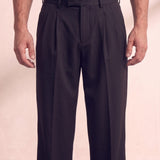 Men's Black Wide Leg Pleated Trousers, close-up of the waistband and front pocket.
