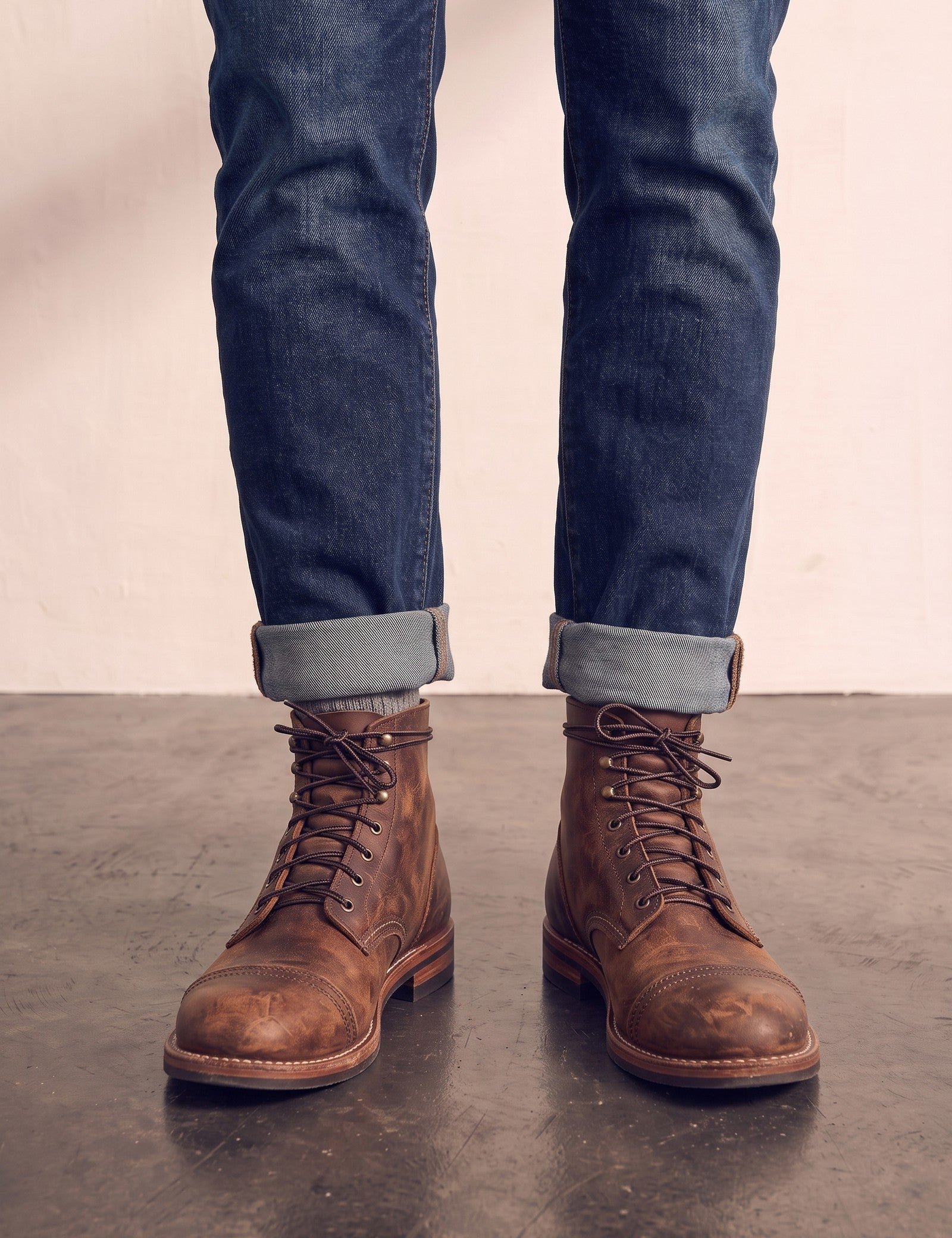 Men's Brown Distressed Lace-Up Mid-Top Work Boots, front view of the shoes, worn.