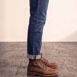 Men's Brown Distressed Lace-Up Mid-Top Work Boots, side view of the shoe, worn.