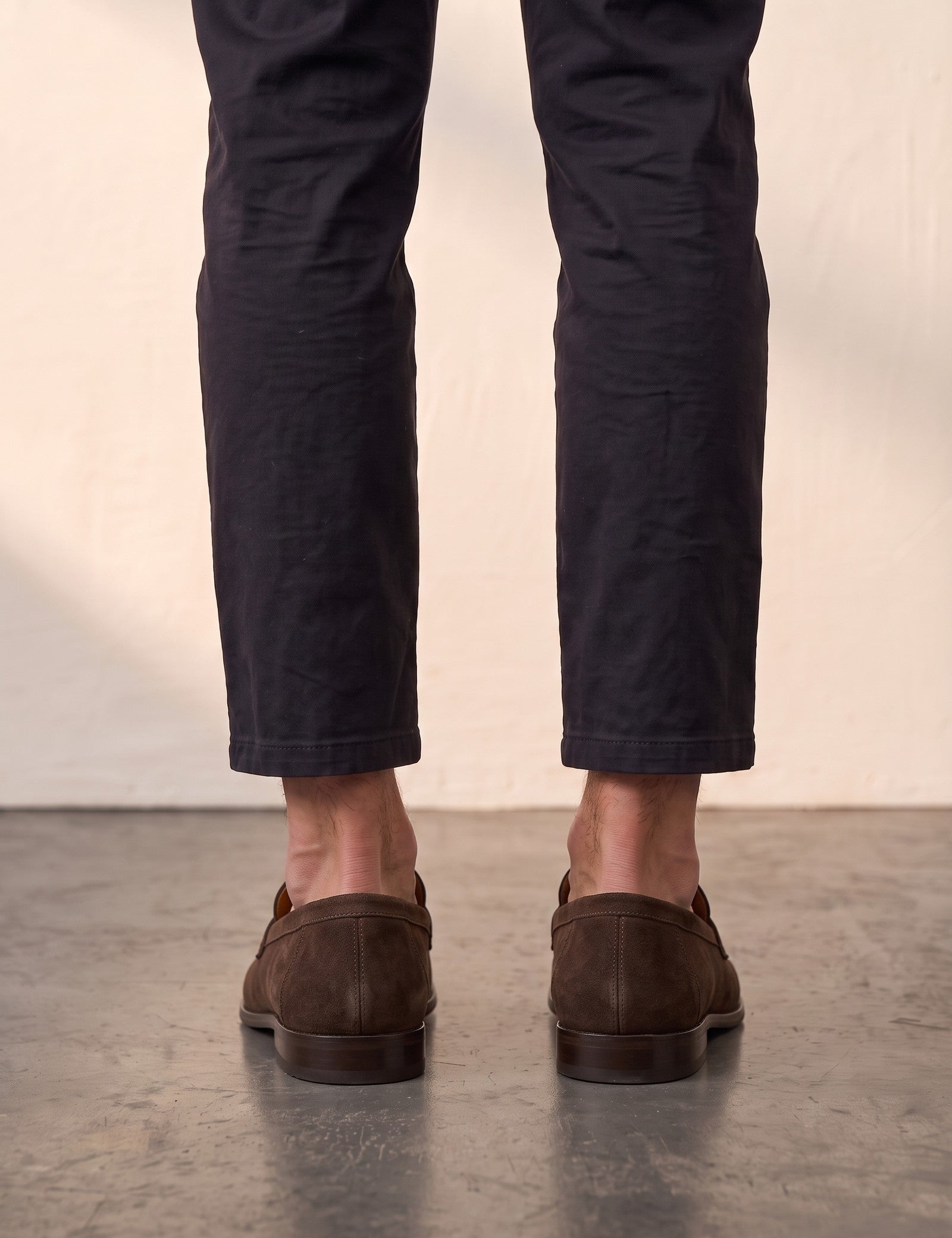 Men's Brown Suede-Effect Penny Loafers, back view of the heels, worn.