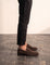 Men's Brown Suede-Effect Penny Loafers, side view of the shoe, worn.
