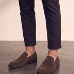 Men's Brown Suede-Effect Penny Loafers, three-quarter front view of the shoes, worn.