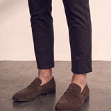 Men's Brown Suede-Effect Penny Loafers, three-quarter front view of the shoes, worn.