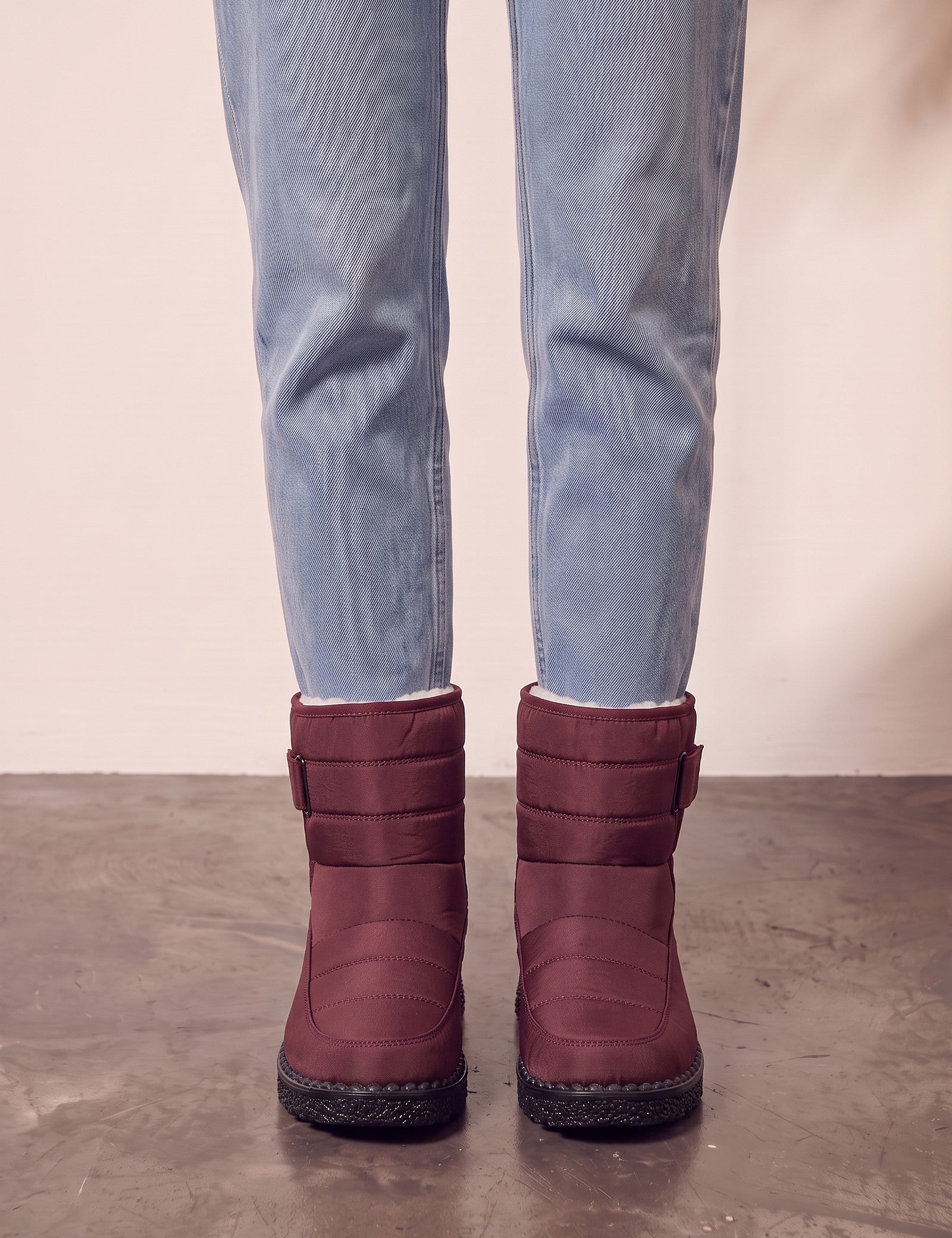 Men's Burgundy Quilted Snow Boots with Ankle Strap, front view of the shoes, worn.