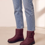 Men's Burgundy Quilted Snow Boots with Ankle Strap, three-quarter front view of the shoes, worn.