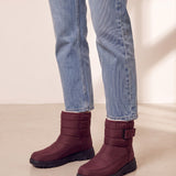 Men's Burgundy Quilted Snow Boots with Ankle Strap, three-quarter front view of the shoes, worn.