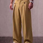 Men's Camel Wide-Leg Pleated Trousers with Button Tabs, three-quarter view from the waist down.