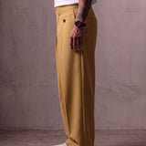 Men's Camel Wide-Leg Pleated Trousers with Button Tabs, side view from the waist down.