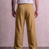 Men's Camel Wide-Leg Pleated Trousers with Button Tabs, back view from the waist down.