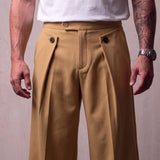 Men's Camel Wide-Leg Pleated Trousers with Button Tabs, close-up of the waistband and front pocket.