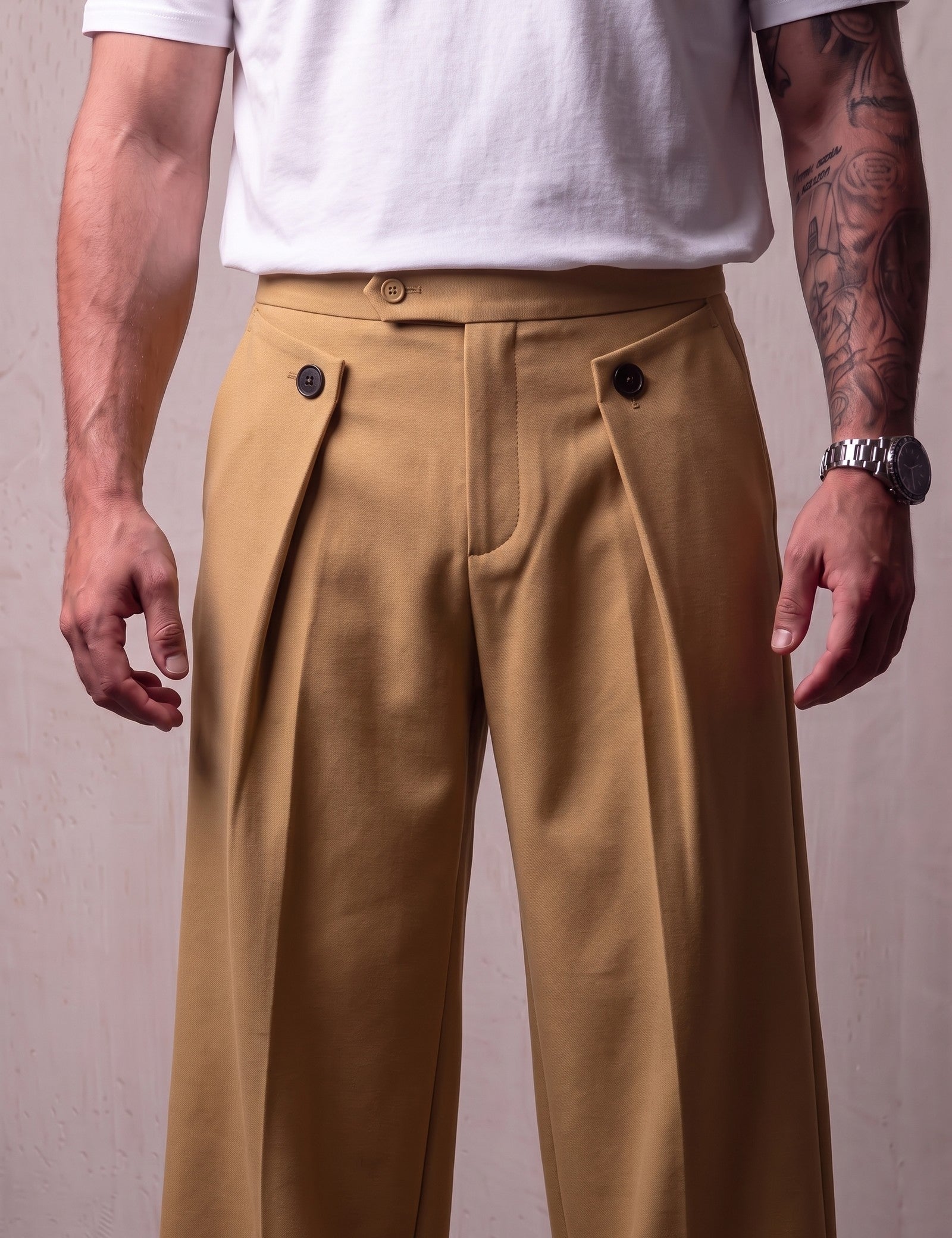 Men's Camel Wide-Leg Pleated Trousers with Button Tabs, close-up of the waistband and front pocket.