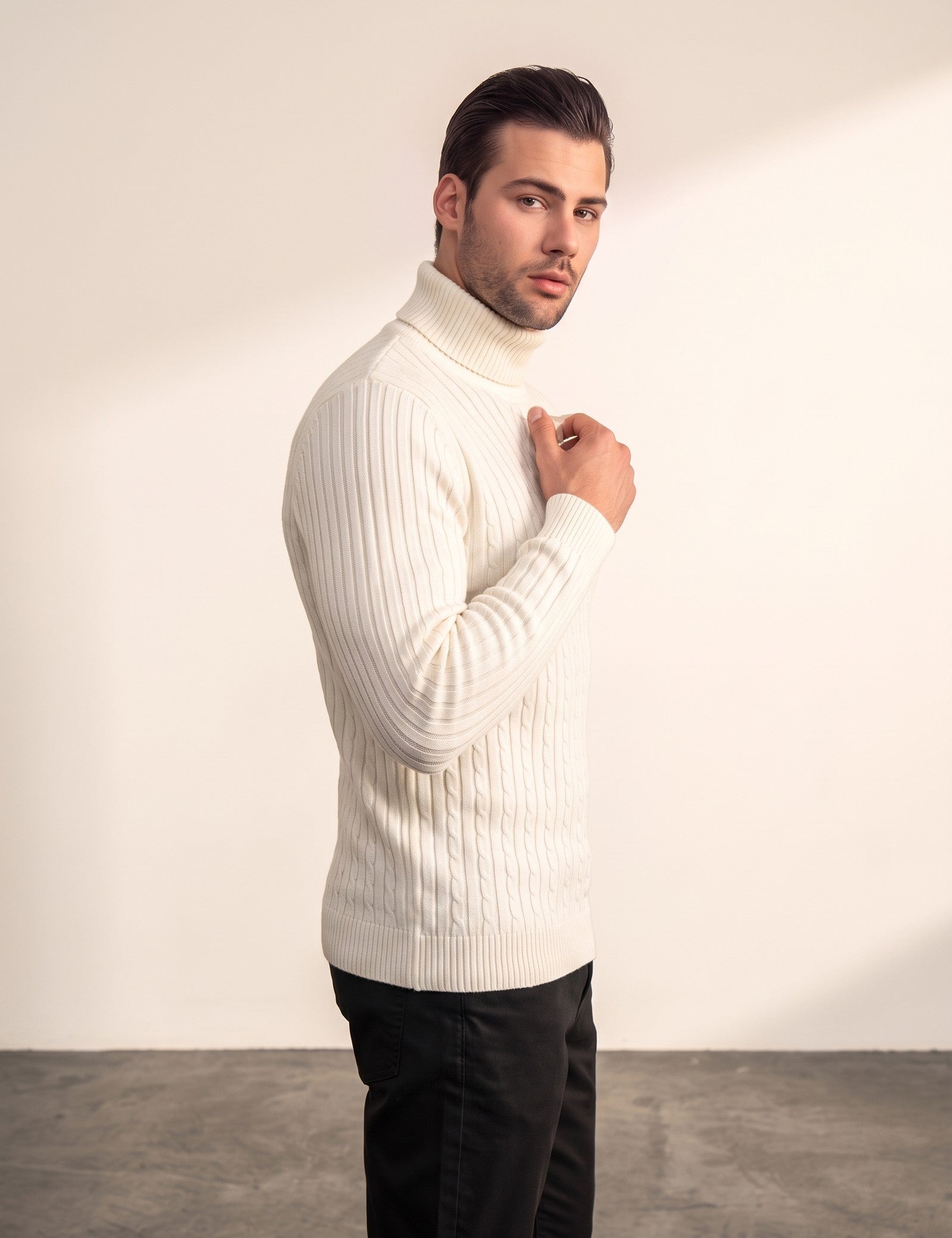 Men's Cream Slim Fit Cable Knit Roll Neck Jumper, side view, full length.