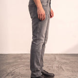 Men's Grey Slim Fit Stretch Denim Jeans, side view from the waist down.