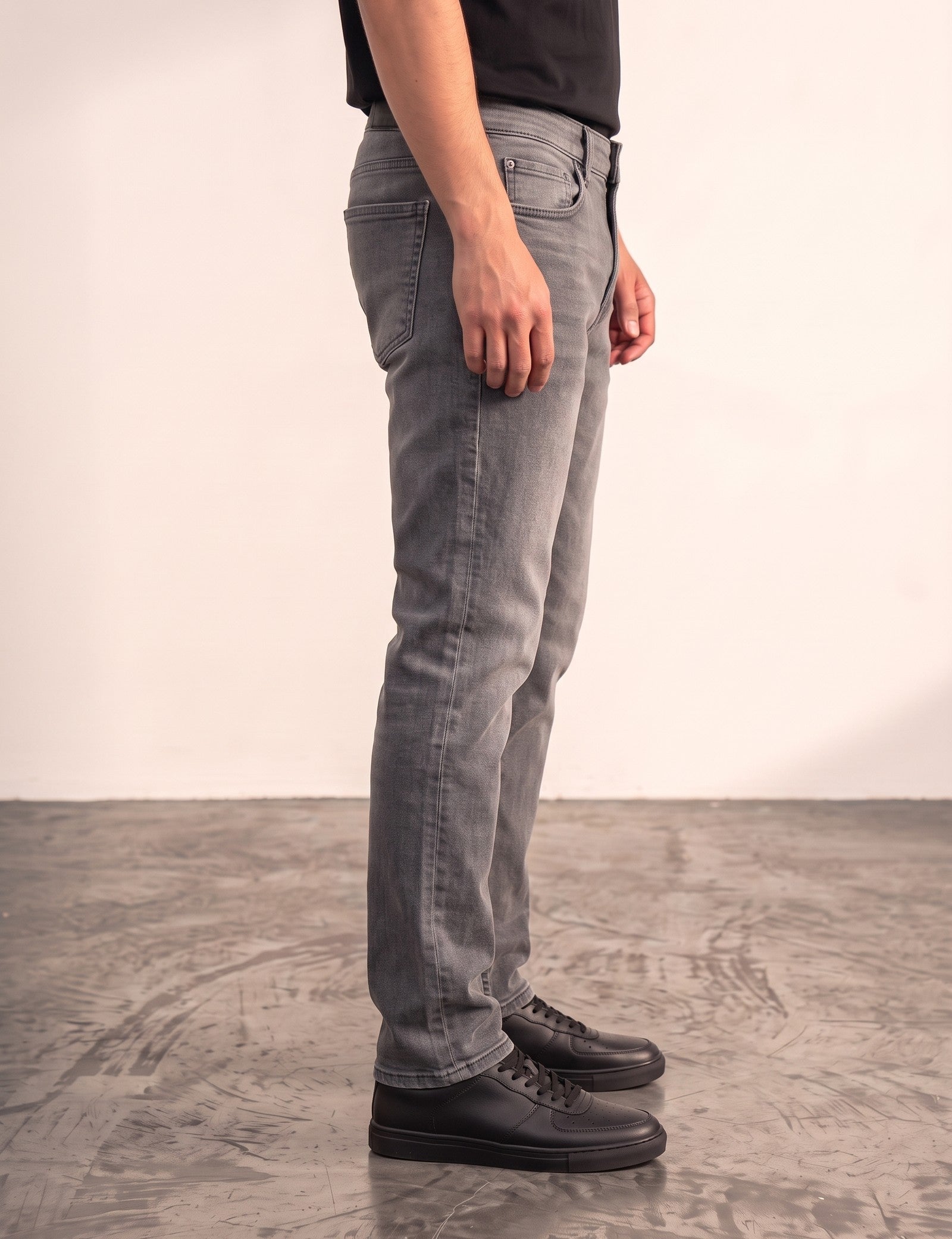 Men's Grey Slim Fit Stretch Denim Jeans, side view from the waist down.