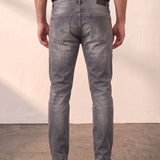 Men's Grey Slim Fit Stretch Denim Jeans, back view from the waist down.