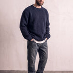Men's Navy Brushed Knit Crew Neck Jumper, three-quarter view from the left, full length.
