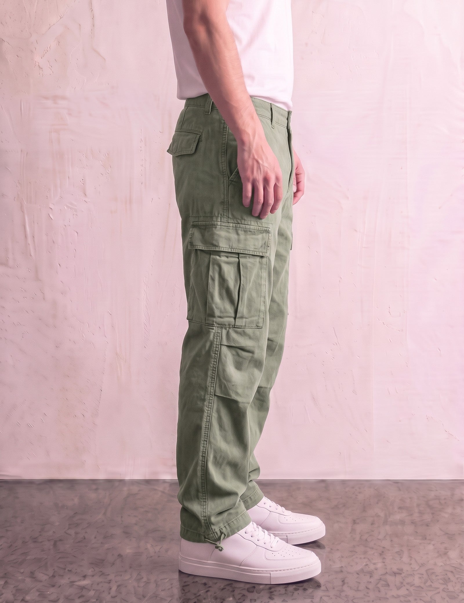 Men's Olive Relaxed Fit Cargo Trousers with Drawcord Hems, side view from the waist down.