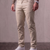 Men's Stone Slim Fit Tapered Chino Trousers, three-quarter view from the waist down.