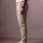 Men's Stone Slim Fit Tapered Chino Trousers, side view from the waist down.