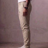 Men's Stone Slim Fit Tapered Chino Trousers, side view from the waist down.