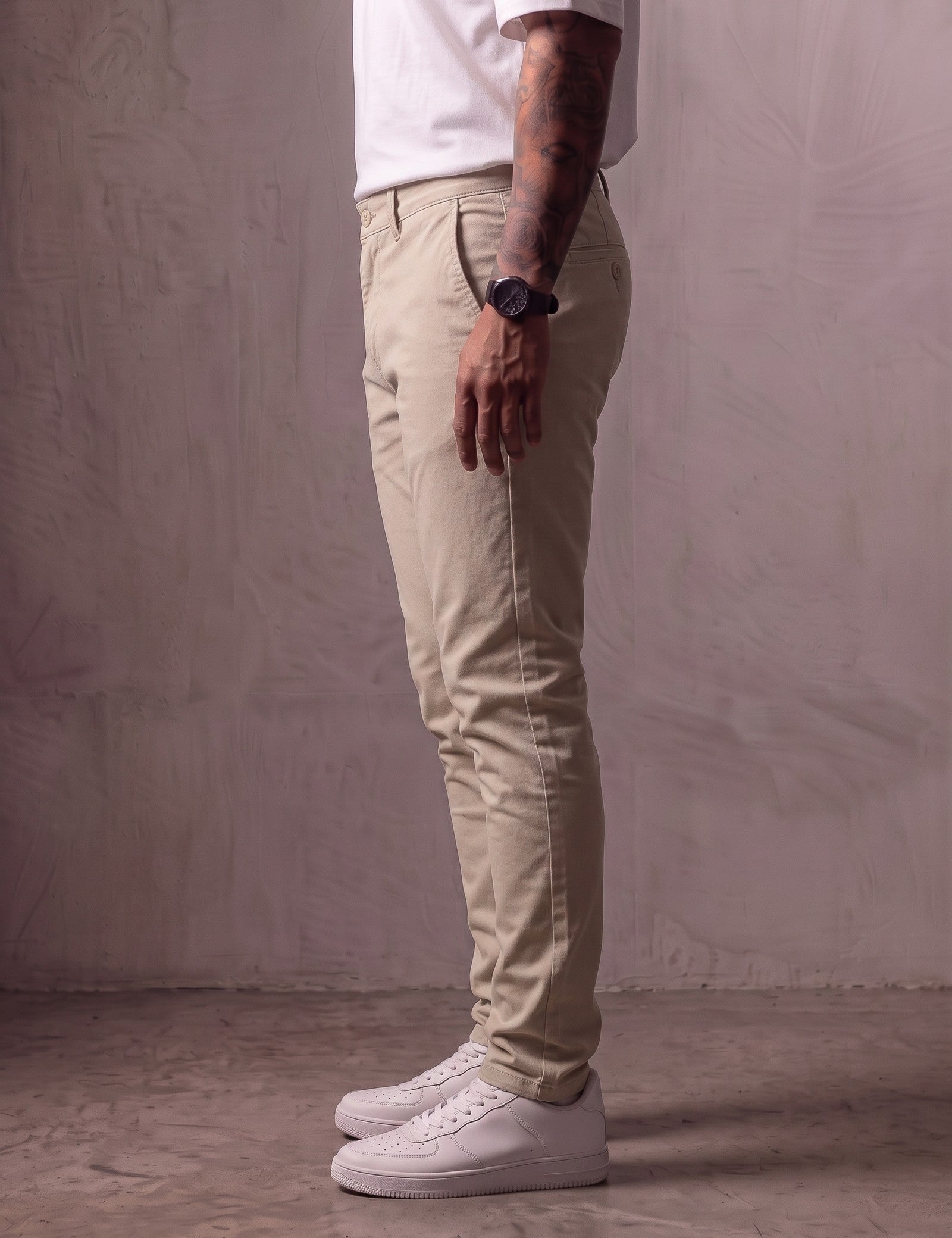 Men's Stone Slim Fit Tapered Chino Trousers, side view from the waist down.
