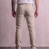 Men's Stone Slim Fit Tapered Chino Trousers, back view from the waist down.