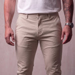 Men's Stone Slim Fit Tapered Chino Trousers, close-up of the waistband and front pocket.